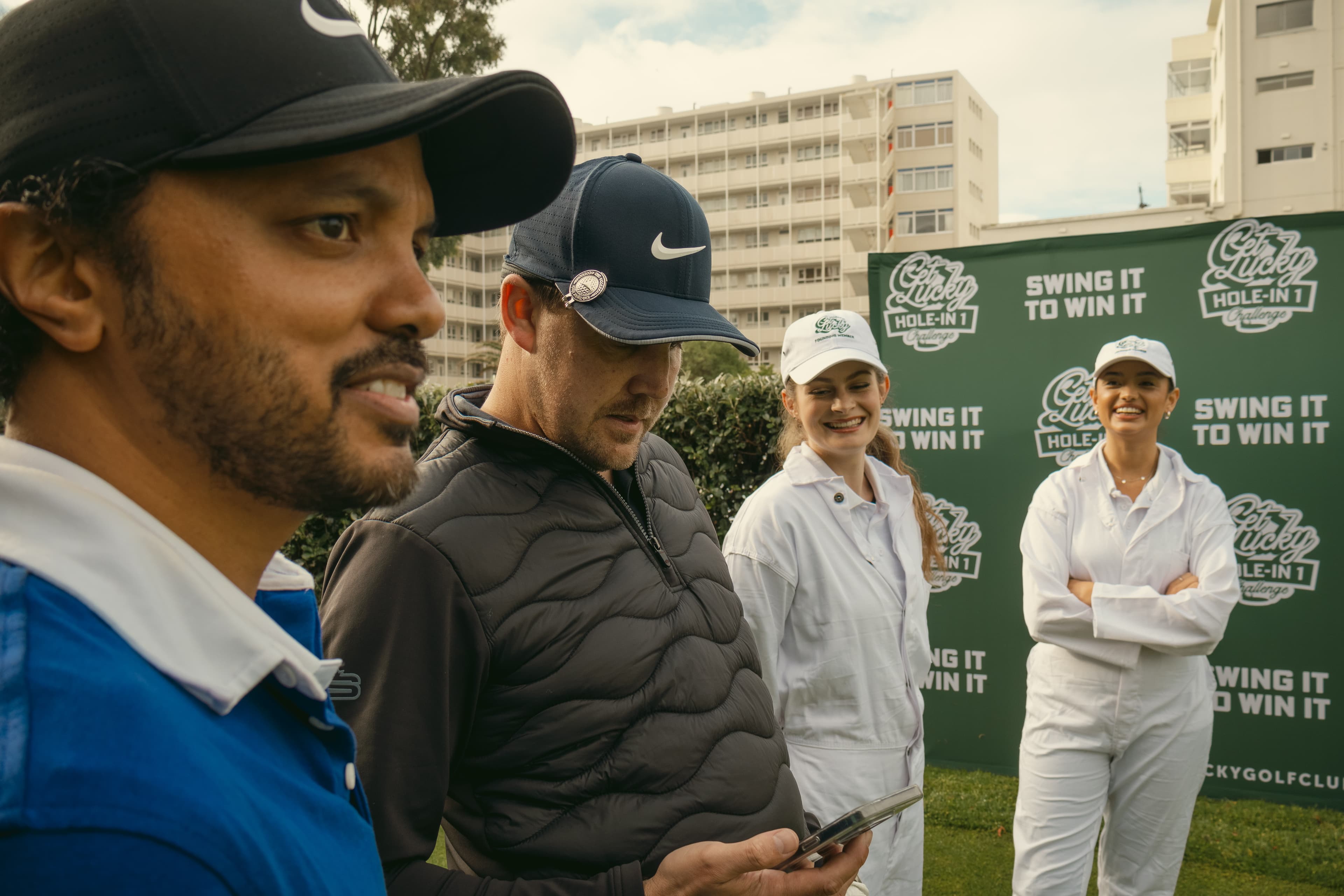 Golfers with Get Lucky branded promoters